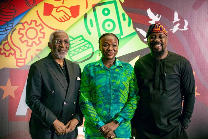 Guests photographed against the Africa Day backdrop.